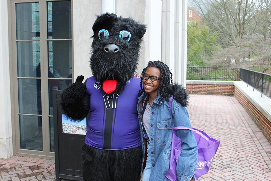 Student poses with Victory, Agnes Scott's mascot.